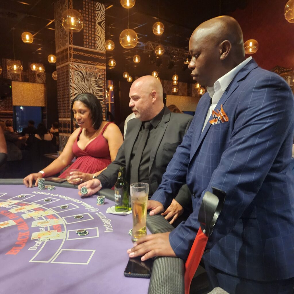 How our fun casino works: guests playing at a professional casino table