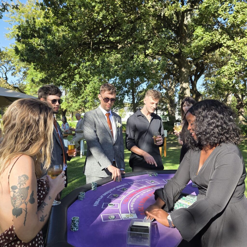 Wedding guests playing at a fun casino table