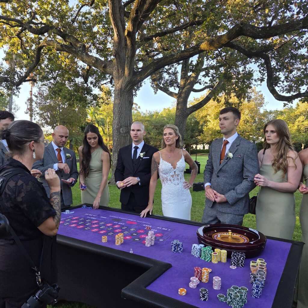 Wedding entertainment: fun casino tables at a garden wedding